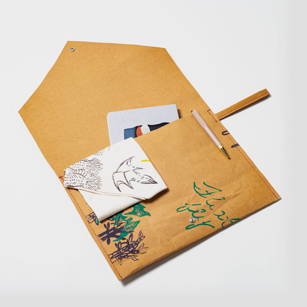 Green, sustainably made washable paper courier bag and laptop protector