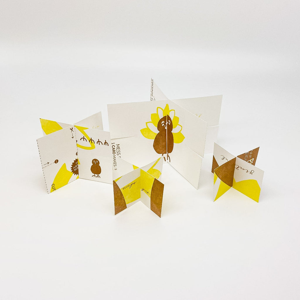 White, Brown and yellow constructable paper toy and card - Constructed