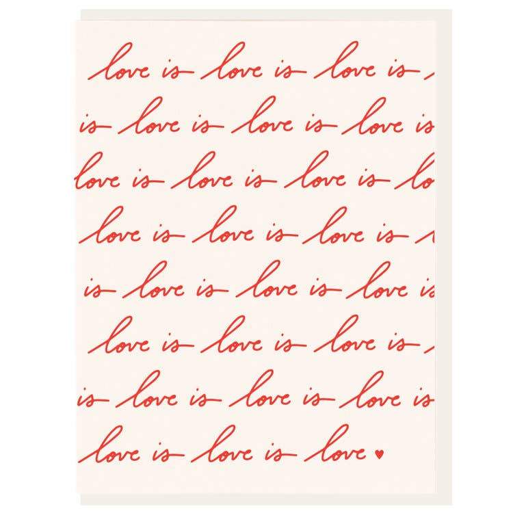 A white letterpress printed card covered in red “Love is” cursive Text  - Austin Gift Shop