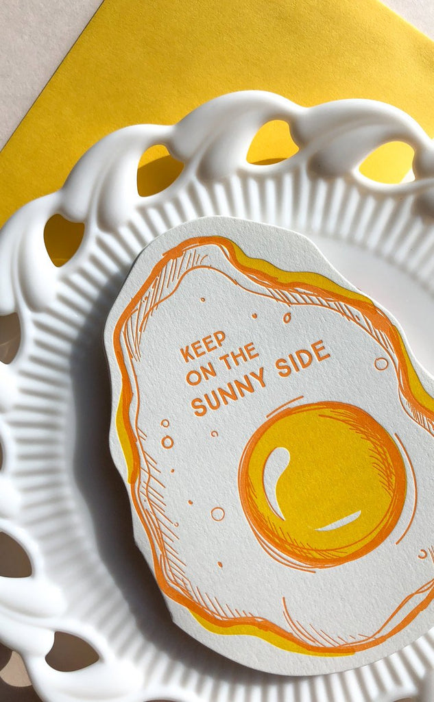 Yellow Letterpress card with a fried egg and keep on the sunny side text -close- Austin Gift Shop
