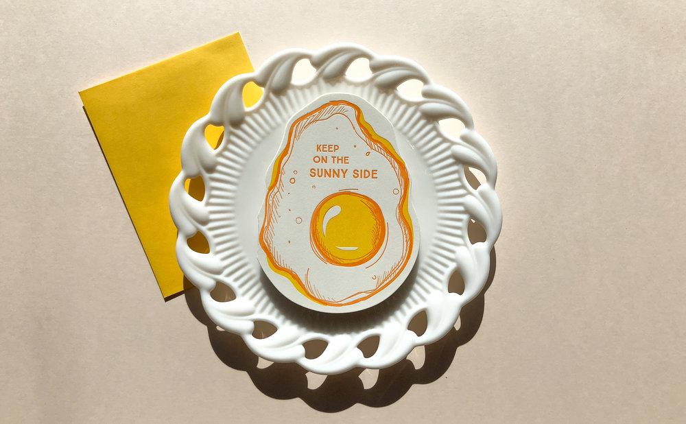 Yellow Letterpress card with a fried egg and keep on the sunny side text -plate- Austin Gift Shop